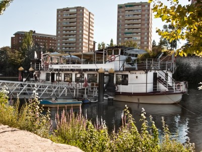 a boat is docked next to a body of water
