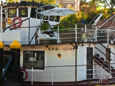 a train is parked on the side of a building