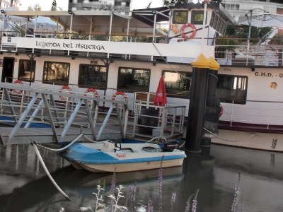 a boat is docked next to a body of water