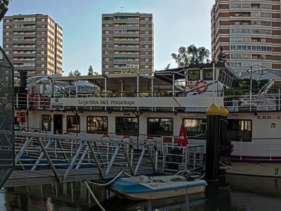 a large body of water with Barbican Centre in the background