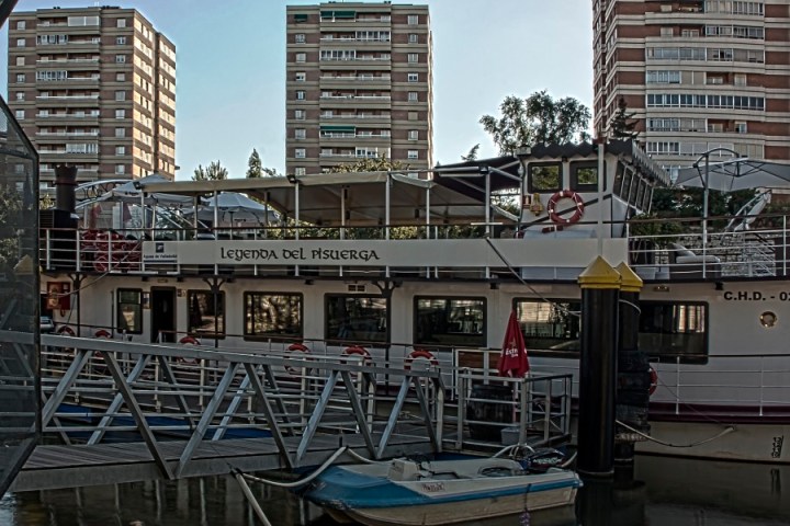 a large body of water with Barbican Centre in the background