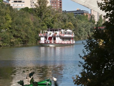 a person in a green boat on a river