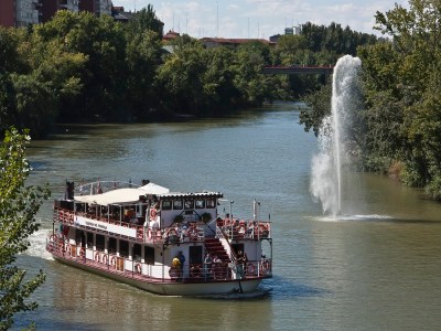 a boat traveling down a river
