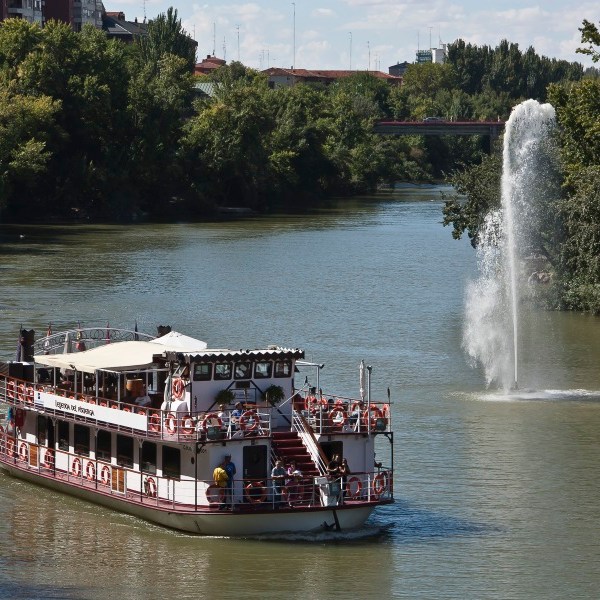 a boat traveling down a river