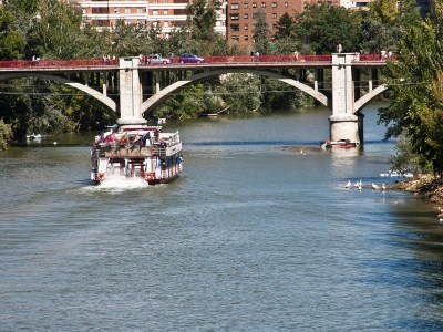 a train crossing a bridge over a body of water