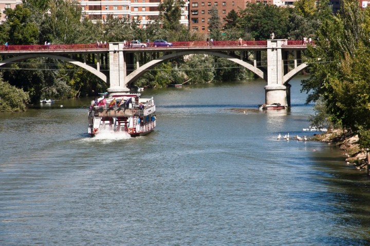a train crossing a bridge over a body of water