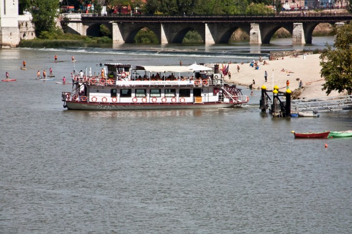 a group of people on a boat in a large body of water